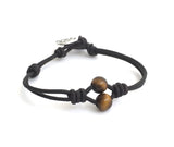 Eye of the Tiger meets Celtic charm. Evil eye protection jewelry, Two peas in a pod design, black leather bracelet with tiger eye gemstones, obsidian gemstones, Celtic know infinity knot charm  button, Irish bracelet, friendship bracelet