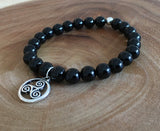 The Triskele represents the potential for experience, growth and wisdom. It is an ancient Celtic symbol that is also known as the Triade, or the Triple Spiral., Onyx chakra healing crystals