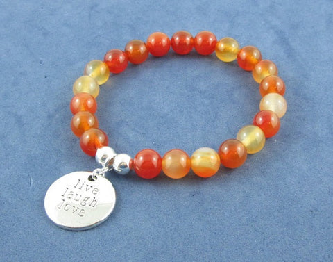 chakra jewelry healing energy crystal bracelet with red carnelian gemstones and inspiring silver charm Live Love Laugh